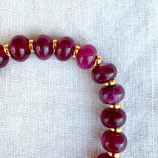 Close-up detail of Granada bracelet with burgundy jade beads and gold-plated accents