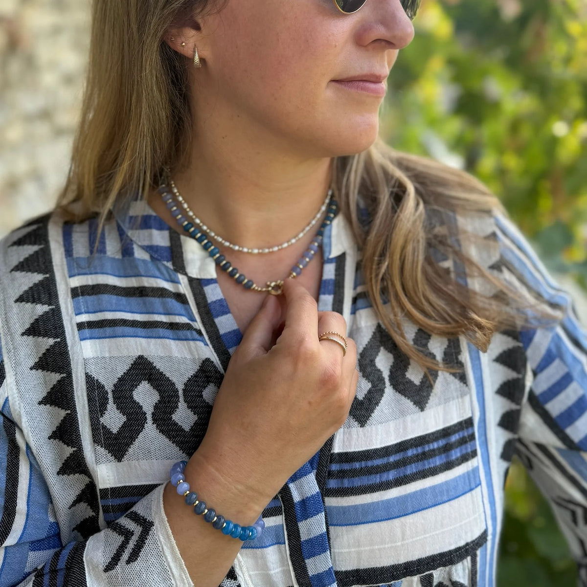 Blue jade bead necklace and bracelet worn together