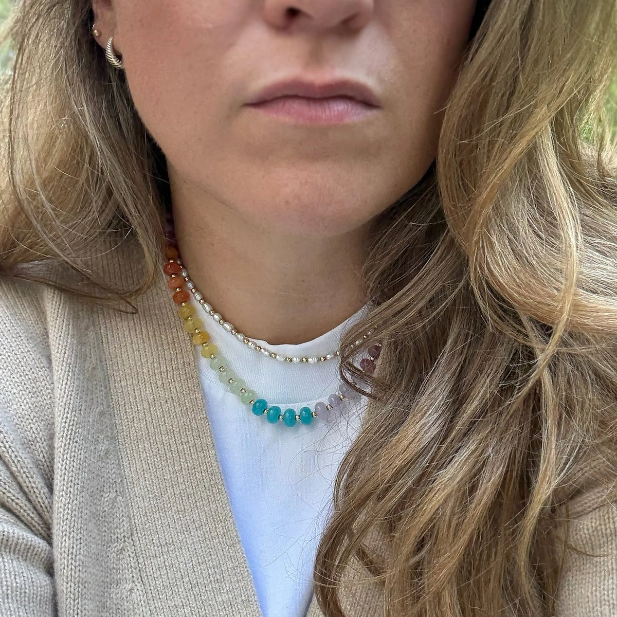 Pastel jade and freshwater pearl necklaces worn layered together