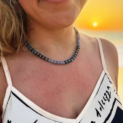 Blue jade bead necklace worn in a layered jewellery look