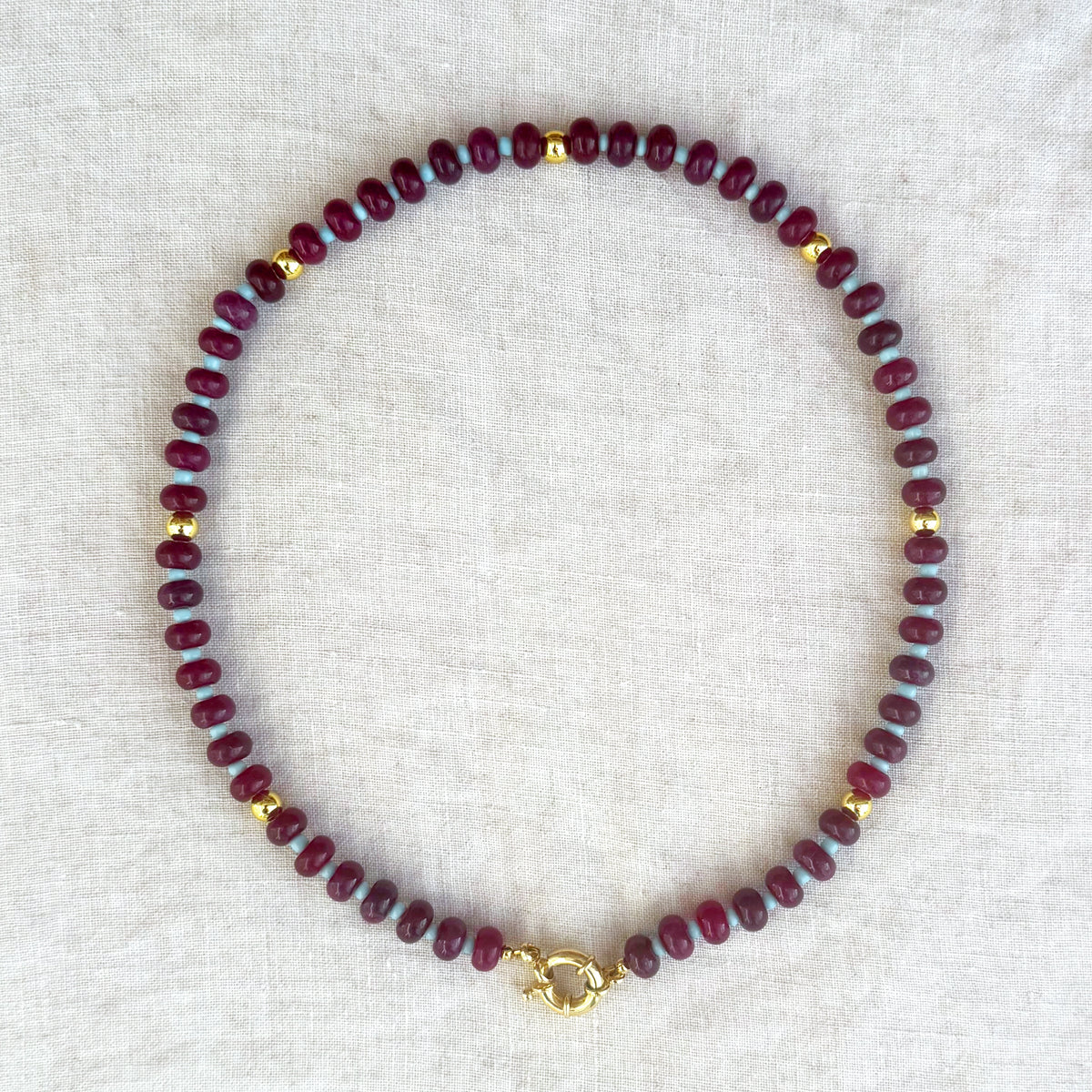 Violetta burgundy jade bead necklace with turquoise accents and gold-plated buoy clasp, full view