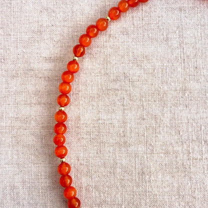 Orange beaded necklace with purple glass octopus pendant Madame Octopussy by Studio Gløra