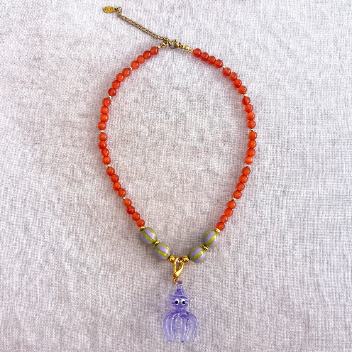 Orange beaded necklace with purple glass octopus pendant Madame Octopussy by Studio Gløra